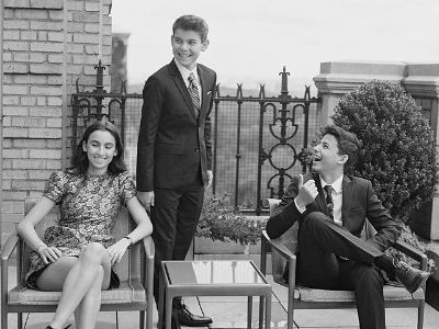 Sascha and Julian Kal Seinfeld are sitting in a chair as Shepherd Kellen Seinfeld is standing.